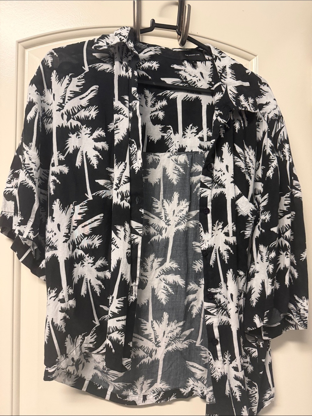 This is the Shoreline—-Classic Black & White Palm-Print Button Down Shirt